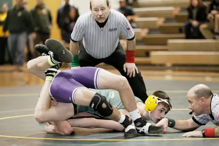Referee Alan Maloney (standing) was one of two referees during this 126 lbs. match between Clearview's Brandon Dick (facing camera) who pinned Cherry Hill West's Shane Tambussi during the Cherry Hill West at Clearview H.S. S.J. Group 4 wrestling final in February 2016.  ( ELIZABETH ROBERTSON / Staff Photographer )