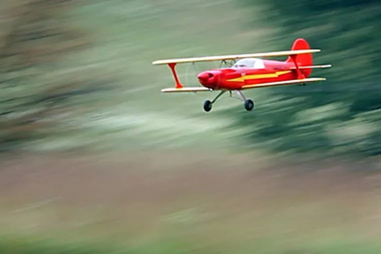 Jim Myers’ biplane comes in for a landing on the runway at Valley Forge National Historical Park during a meeting of the Valley Forge Signal Seekers. (LAURENCE KESTERSON / Staff Photographer)