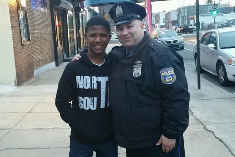 Officer Frank Gramlich (right) has befriended Hassan Cox (left), 12. Cox was holding his little sister's hand when she was killed by a hit-and-run driver.