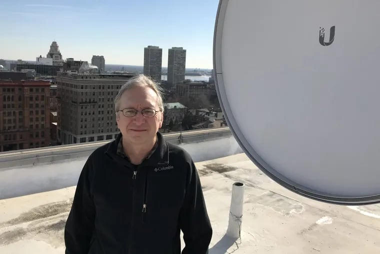 Mark Steckel is offering $50 a month high-speed fixed-wireless internet in the river wards in Philadelphia, competing with Comcast and Verizon. He distributes the broadband over rooftop  antennas such as the one here on the former Dow building on Independence Mall.