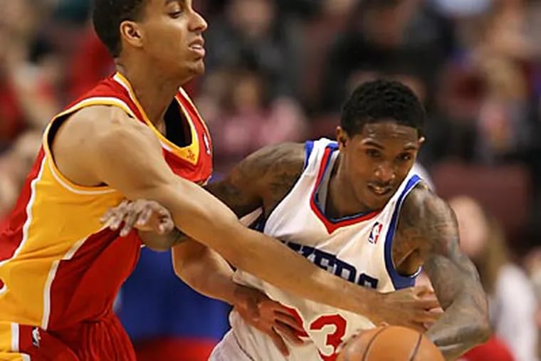 Lou Williams gets fouled by the Rockets' Kevin Martin during the second quarter. (Steven M. Falk / Staff Photographer)