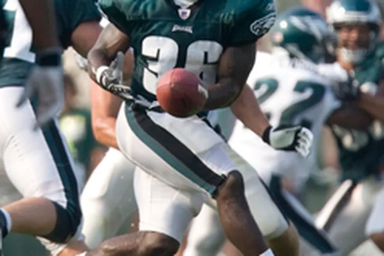 Brian Westbrook has the ball on his fingertips but cannot hold on during the morning practice.
