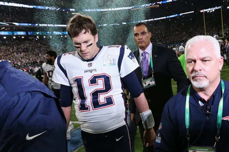 New England Patriots quarterback Tom Brady leaves the field.