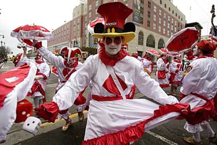 Zack Kreschollek, 16, of South Philly, and the Holy Rollers N.Y.B. comics strut up South Broad Street near the front of the 2008 Mummers Parade. (Ed Hille  / Staff Photographer)