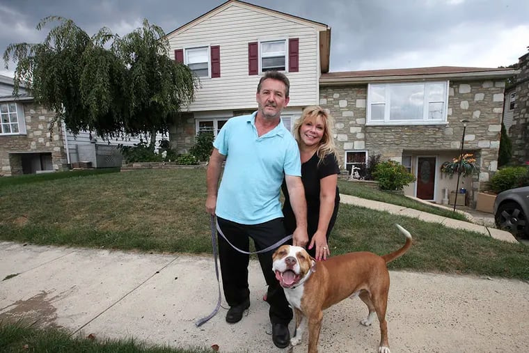 Christos, left and Markela Sourovelis in front of their Northeast Philadelphia home on Tuesday, September 16, 2014. ( Steven M. Falk / Staff Photographer )