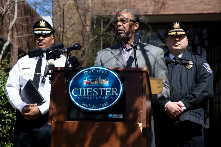 Chester Mayor Thaddeus Kirkland, center, flanked by Chester Police Commissioner Otis Blair, left, and Deputy Police Commissioner Steven Gretsky, right, spoke on Monday about Sunday night's fatal shooting of 7-year-old Sinsir Parker during a news conference outside of Chester City Hall in Chester, Pa.