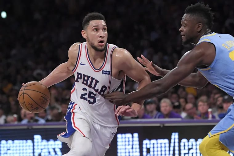 Sixers guard Ben Simmons, left, drives toward the basket as Los Angeles Lakers forward Julius Randle defends during the second half of the Sixers’ win on Wednesday.