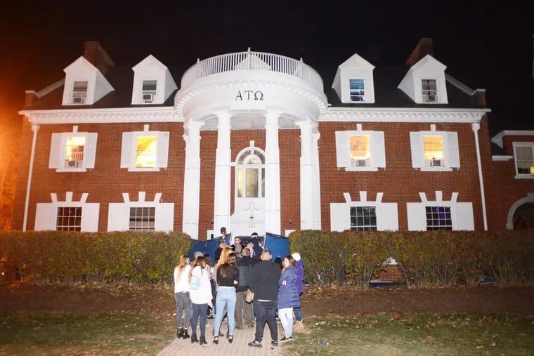 Party-goers arrive at a Penn State fraternity party on the Saturday night after homecoming in early November. (WILLIAM THOMAS CAIN / For The Inquirer)