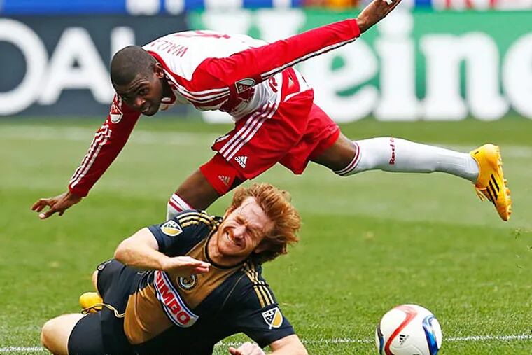 Philadelphia Union forward Fernando Aristeguieta (bottom) and New York Red Bulls defender Anthony Wallace (top) fight for the ball during a quarterfinal match of the US Open Cup at Red Bull Arena. (Saed Hindash/NJ Advance Media for NJ.com via USA Today)