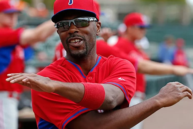 Jimmy Rollins warms up before before an exhibition spring training baseball game against the Baltimore Orioles in Sarasota, Fla., Friday, March 7, 2014. (Gene J. Puskar/AP)
