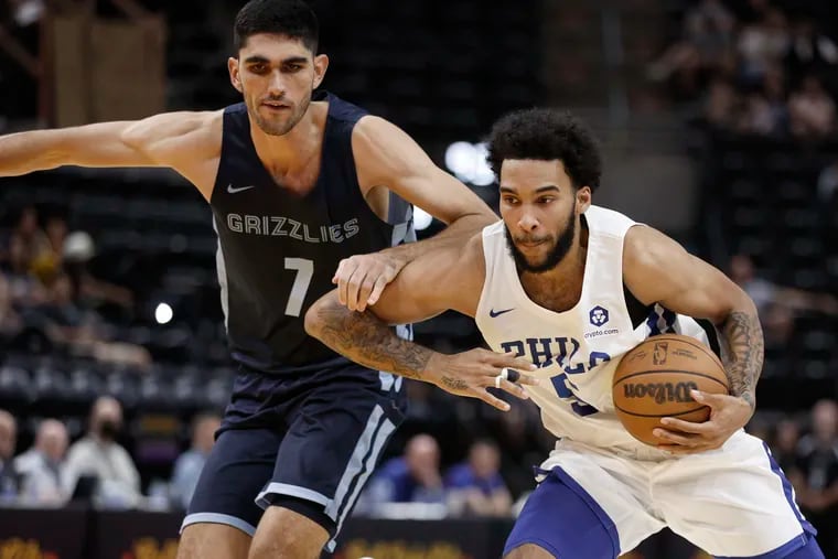Sixers forward Julian Champagnie (5) is defended by Memphis Grizzlies forward Santi Aldama during the second half of an NBA summer league game Tuesday in Salt Lake City.