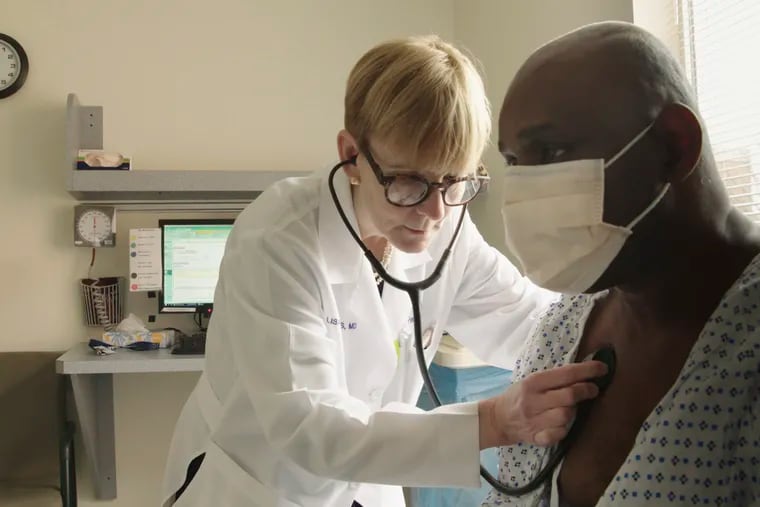 This photo provided by Netflix shows Lisa Sanders examining a patient in a scene from the new Netflix series “Diagnosis,” which transports Sanders’ column from the pages of the New York Times to television. The show, which was available starting Aug. 16, harnesses the internet and social media to diagnose unusual cases.