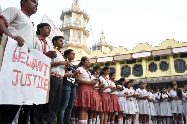 Students at the Convent of Jesus and Mary School about 50 miles northeast of Kolkata, India, take part in protesting the attack that left a nun at their school in serious condition. PRANAB DEBNATH / AP