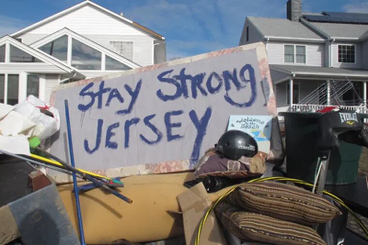 Residents of a flood-wrecked home in Point Pleasant Beach N.J. offer encouragement to fellow victims of Superstorm Sandy on Monday, Nov. 5, 2012, in this message scrawled on the bottom of a waterlogged mattress. A new storm, this one a nor'easter, was due to hit the shore Wednesday, raising fears of renewed damage and flooding. (AP Photo/Wayne Parry)