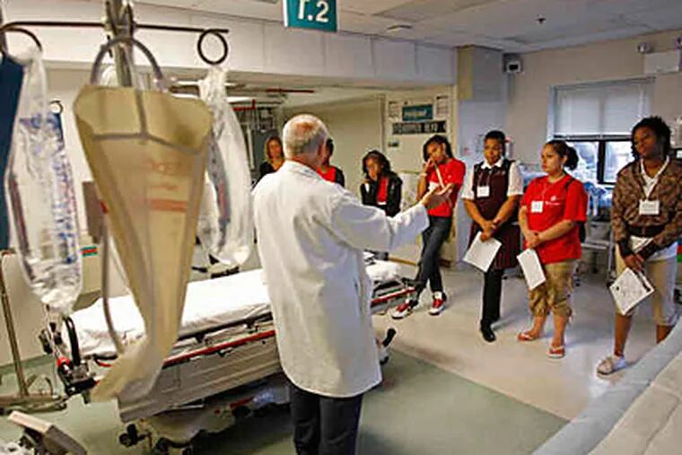 At Cooper University Hospital, trauma nurse David Groves explains his job during the students' visit to the hospital's helipad. (Michael S. Wirtz / Staff photographer)