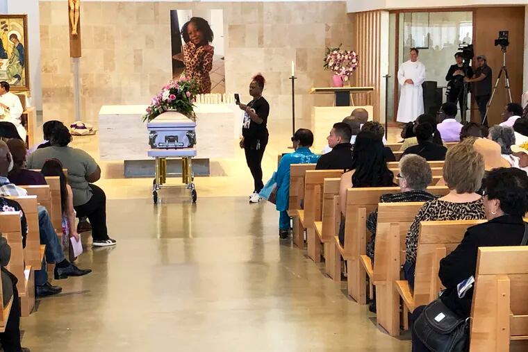 Mourners gather for the funeral service of Trinity Love Jones, the 9-year-old whose body was found this month stuffed in a duffel bag along an equestrian trail, at St. John Vianney Catholic Church in Hacienda Heights, Calif., Monday, March 25, 2019. The Hacienda Heights community where her body was found had embraced the child in death during the days she remained unidentified. A park worker found Trinity on March 5. A huge memorial sprang up at the site as community members heard about the case. She was identified the following weekend and prosecutors have since filed murder charges against her mother and the mother's boyfriend. (AP Photo/John Rogers)