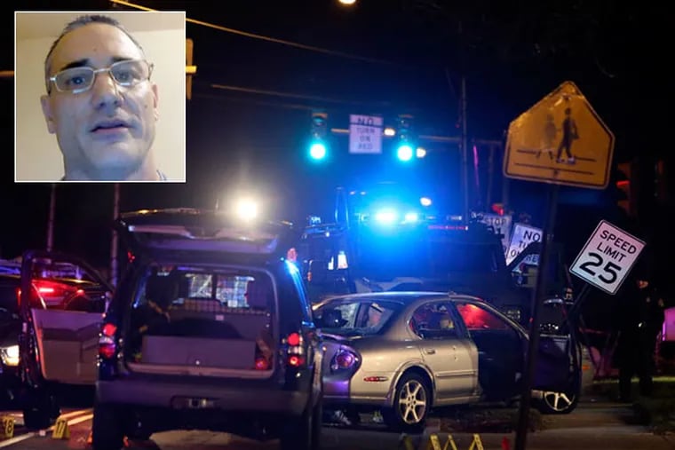 Police investigate the crime scene on Garrett Road in Drexel Hill
on Tuesday, Dec. 30, 2014, after officers fatally shot Joseph Pacini (pictured).