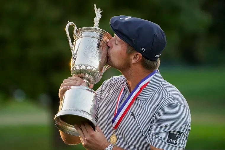 Bryson DeChambeau kisses the winner's trophy after winning US Open Golf Championship Sunday.