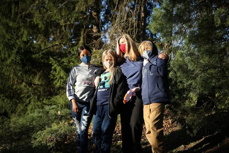 Maura Sammon (second from right) with her daughter, Lina VanDolder (second from left), her son, Kaes VanDolder (right) and their au pair, Lerato Zulu (left) in Wynnewood. Sammon is an ER doctor at Temple.