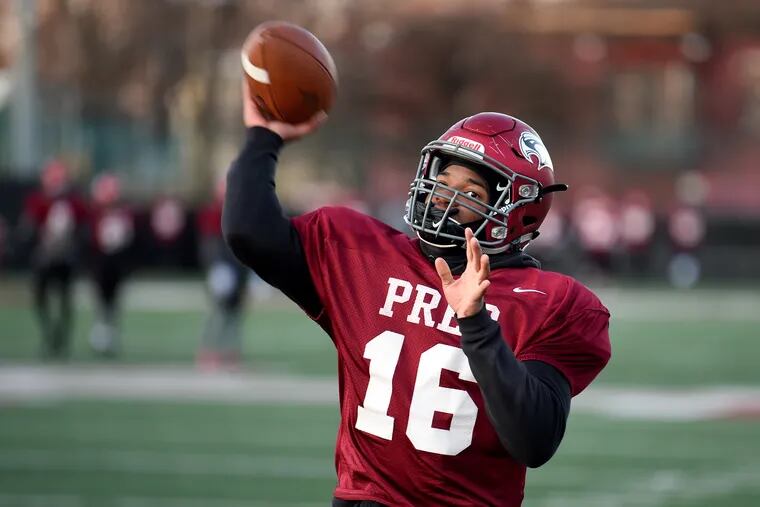 St. Joseph's Prep junior Malik Cooper warms up during practice at the Temple University practice field.