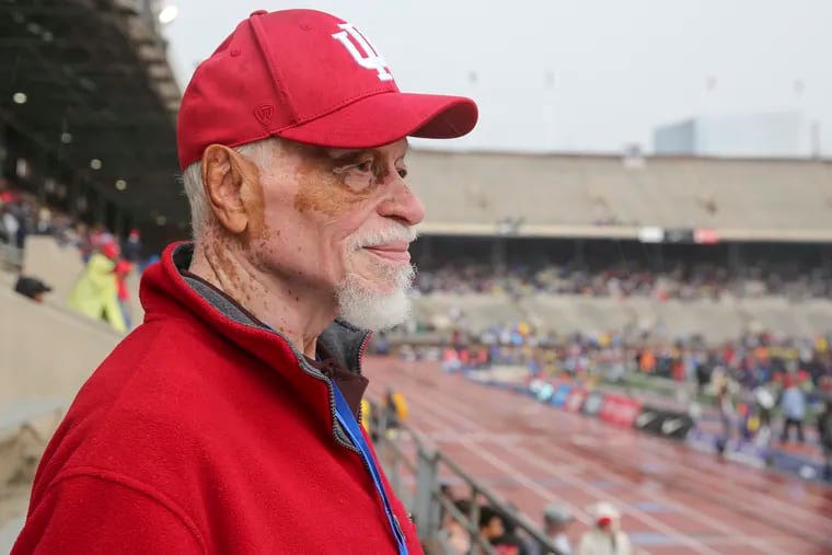 Greg Bell, former track and field athlete and Olympic gold medalist, watches the Penn Relays at Franklin Field on Friday.