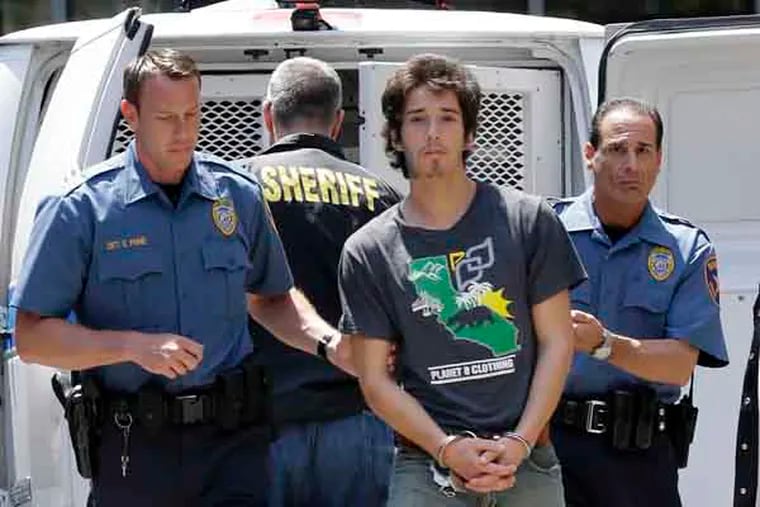 FILE - Caleb "Kai" McGillvary, 24,  is taken in for processing in Elizabeth, N.J., Thursday, May 30, 2013, before being taken to jail.  McGillvary was convicted Wednesday, April 24, 2019, of beating 73-year-old lawyer Joseph Galfy to death after they met in New York City. (AP Photo / Mel Evans)