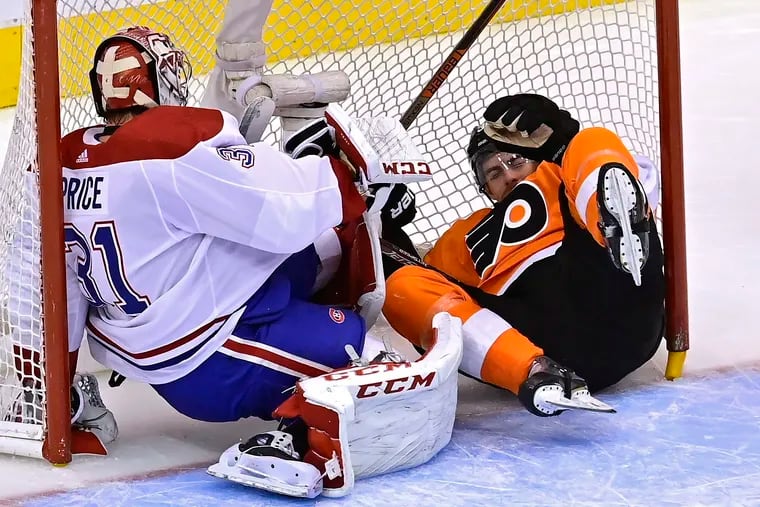Derek Grant crashes into Montreal goaltender Carey Price during the first period on Wednesday. Grant was knocked into the Canadiens netminder by Montreal defenseman Xavier Ouellet.