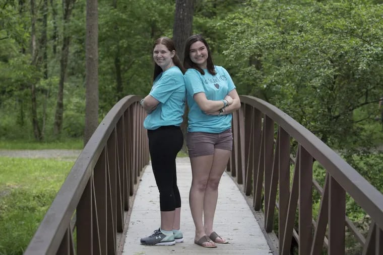 Taylor Kulp, left and Erin Harten, right, pose at the Anson B. Nixon Park in Kennett Square, site of the June 3 Race to Beat POTS.