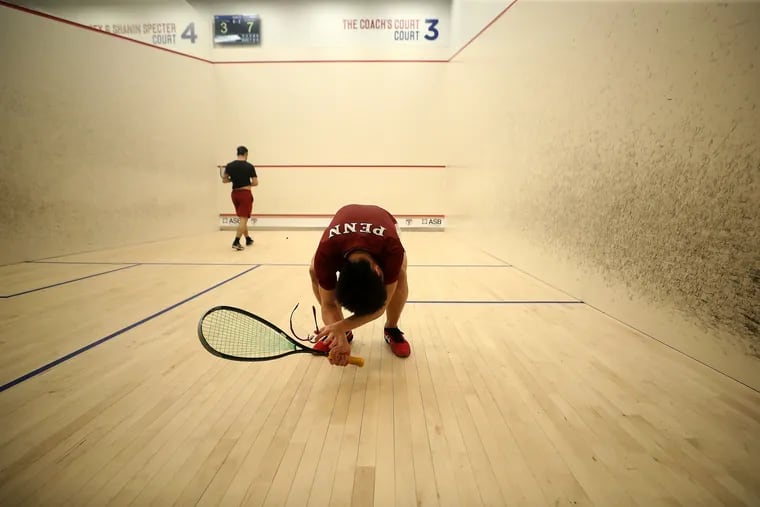 Penn’s Nathan Kueh (right) reacts to losing a point to Harvard’s Ido Burstein as Penn and Harvard play for the CSA championship at Penn Squash Center in Philadelphia, Pa. on Sunday, Feb. 20, 2022. Harvard won the championship.