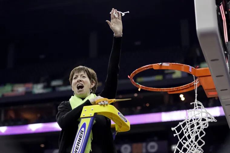 Notre Dame head coach Muffet McGraw celebrates by cutting down the net after defeating Mississippi State in the final of the women's NCAA Final Four college basketball tournament, Sunday, April 1, 2018, in Columbus, Ohio. Notre Dame won 61-58.