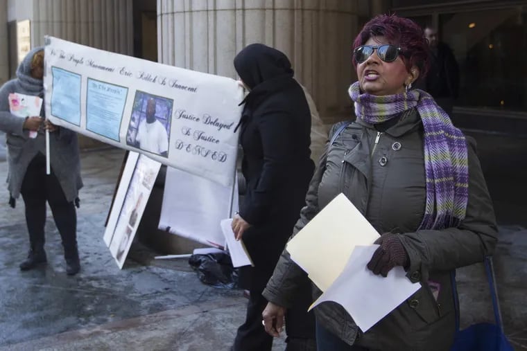 Christine Riddick, mother of Eric Riddick, demonstrates outside the District Attorney’s Office in Center City. She, her son, and others contend he has been imprisoned for a murder he did not commit.