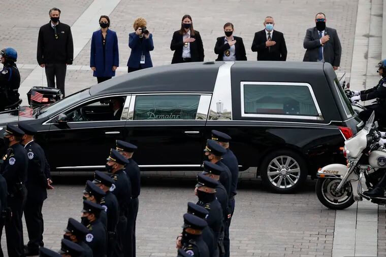 A hearse carrying the casket of slain U.S. Capitol Police officer William “Billy” Evans arrives at the Capitol on Tuesday.