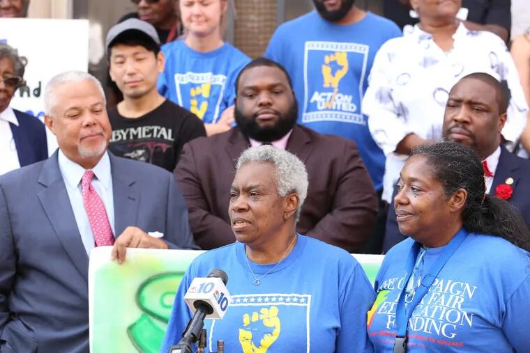 Wilma Frazier (front center) and Maria Ortiz (front right) speak to a group of parents and community members at a news conference Oct. 19, 2016, asking the Philadelphia School District to re-open Smith School, at 19th and Wharton Streets, in South Philadelphia.