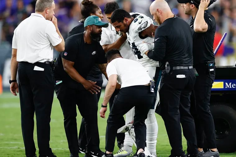 Eagles linebacker Shaun Bradley gets help standing after getting injured during the third quarter in a preseason game against the Baltimore Ravens at M&T Bank Stadium in Baltimore, MD on Saturday, August 12, 2023.