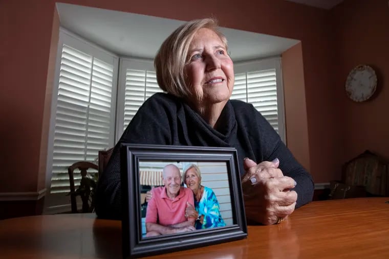 Tina Brubaker, 80, at her Wynnewood home with a photo of her and her husband, Bill, who died earlier this month.