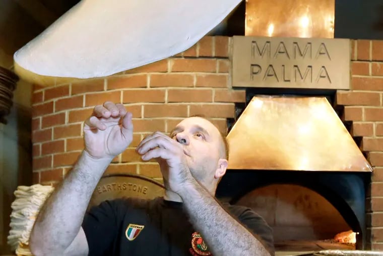Renato Russo tossing one up there in 2016 at Mama Palma's Wood Fired Brick Oven Pizza.