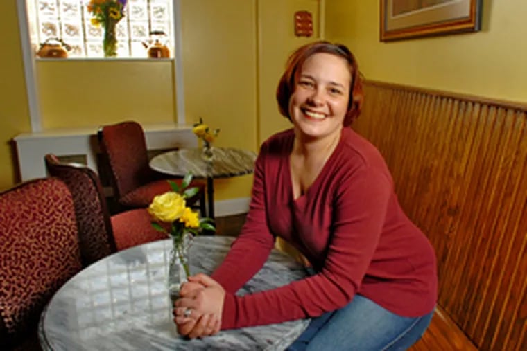 Mary Kate McCaughey sits in the dining room of Ida Mae&#0039;s, her &quot;bruncherie.&quot;