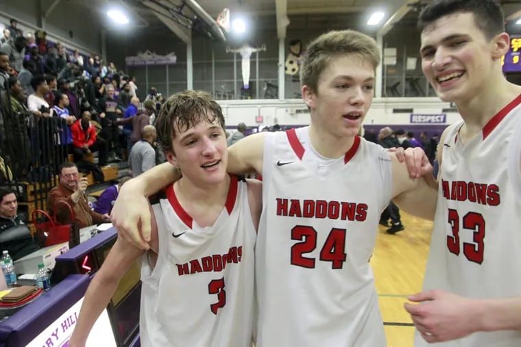 Haddonfield's Mike DePersia (3), Aiden Blake (24) and Dan Fleming  celebrate their 54-53 overtime win against Camden.