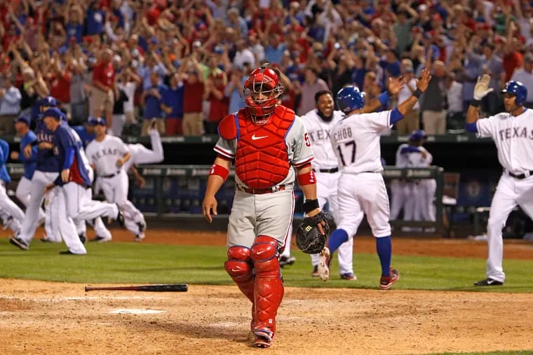 Phillies Carlos Ruiz walks off after Rangers game winning single by Beltre, Adrian in the bottom of 9th to win 3-2.  Philadelphia Phillies v Texas Rangers on Tuesday, April 1, 2014 at  Globe Life Park in Arlington,Tx.  ( RON CORTES / Staff Photographer )