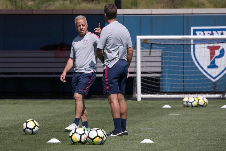 United States men’s soccer team interim head coach Dave Sarachan chats with assistant John Hackworth, a former Philadelphia Union manager, during the opening day of training camp at Penn’s Rhodes Field.