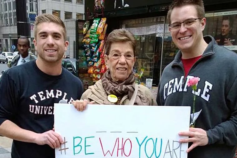 The creators of, “Be Who You Are Documentary,” giving out over 500 carnations in Philadelphia. (Jon Ristaino, Granny Peace Brigade Member & Levi Schenk)   (Photo credit:  John Ristaino_