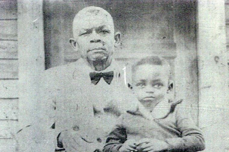 Karin D. Berry's maternal great-grandfather, Charles Brown, with his grandson, Elvin Hudson, in Baton Rouge, La., in the late 1930s. Charles' father was lynched in 1879.