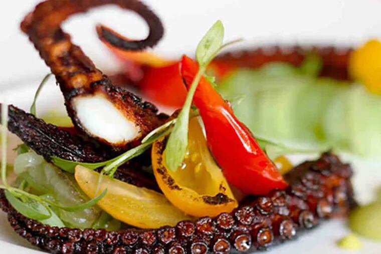 Octopus with charred tomatoes, tomatillo-avocado salsa, and cucumber at Mica. (David M Warren / Staff Photographer)