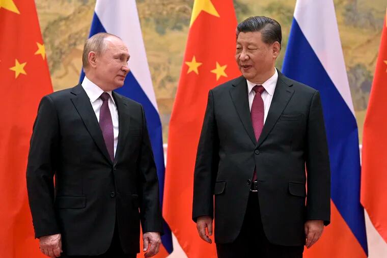 Chinese President Xi Jinping, right, and Russian President Vladimir Putin talk during a meeting in Beijing in February.