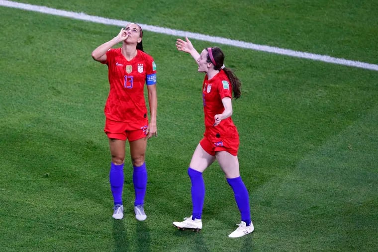 Alex Morgan (left) won't be able to recreate her famous tea-drinking goal celebration when the U.S. women's soccer team plays at England in October.