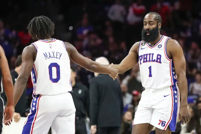 Sixers guards Tyrese Maxey and James Harden high-five during a game against the San Antonio Spurs at the Wells Fargo Center in Philadelphia on Saturday, Oct. 22, 2022.