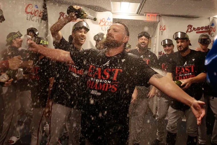 The Braves celebrate winning another NL East crown after defeating the Phillies on Wednesday at Citizens Bank Park.