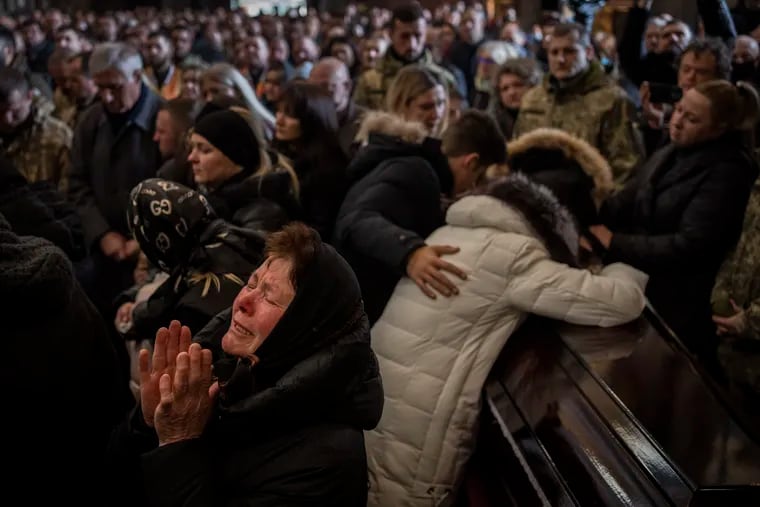 Relatives and friends attending a funeral ceremony for four of the Ukrainian military servicemen who were killed during an airstrike in a military base in Yavoriv, in a church in Lviv, Ukraine, on Tuesday.
