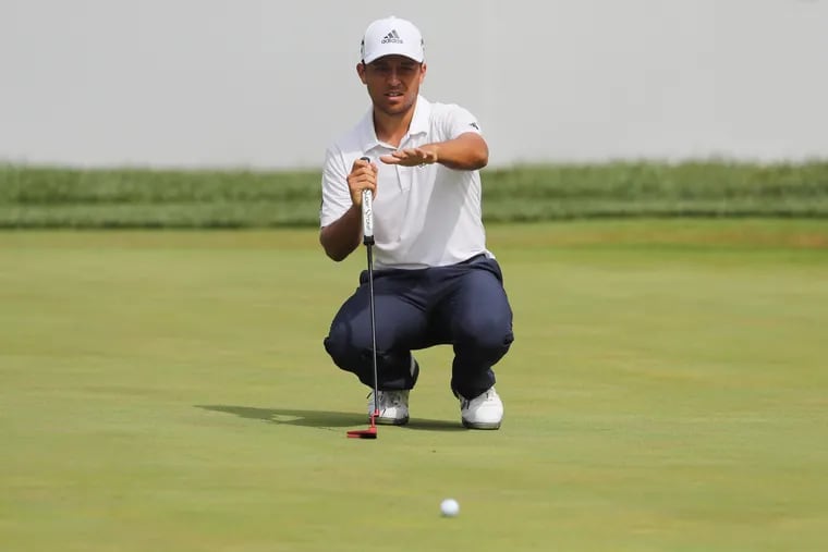 Xander Schauffele lines up a putt the 18th green at the BMW Championship at the Aronimink Golf Club in Newtown Square.