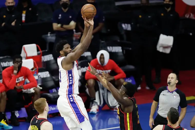 Sixers center Joel Embiid shoots over Atlanta Hawks center Clint Capela in Game 7 of the Eastern Conference semifinals.